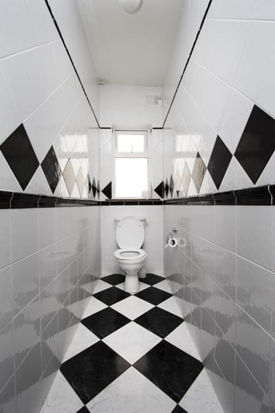 Immaculate black & white tiled restroom